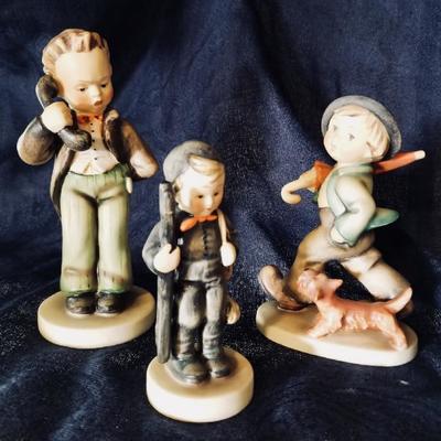 Hummel figurines. [left] $40 ... [center] $40 .... [right] $70