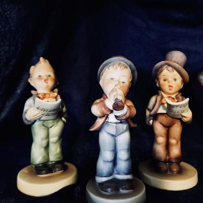Hummel figurines. [left] $12 ..... [center] $30 .... [right] $25