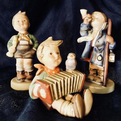 Hummel figurines. [left] $30 .... [center] $50 .... [right] $25