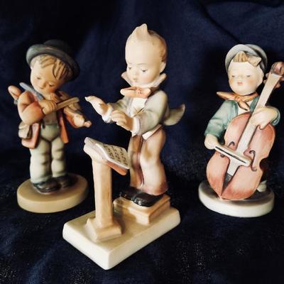 Hummel figurines. [left] $75 .... [center] $30 .... [right] $45