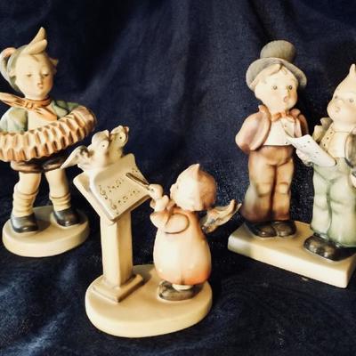 Hummel figurines. [left] $25 .... [center] $45 .... [right] $75