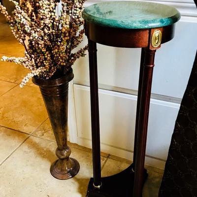 Tall skinny mahogany stand w/ green marble top. $46. Tall vase w/ dry stems. $28  