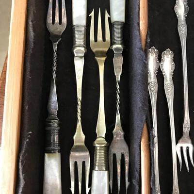 Olive or pickle forks. Mother of pearl handles.