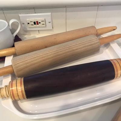 2 wooden rolling pins. 1 heavy upscale mahogany and bone rolling pin.
