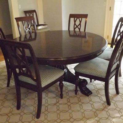 Stanley Round Mahogany Dining Table with chairs. Seats 6-10. Available offsite.