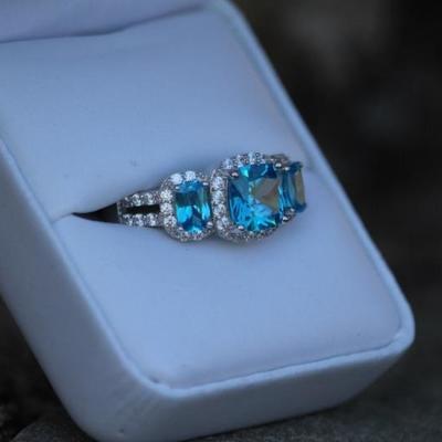 Sterling 3 Stone Blue Topaz Halo Ring 