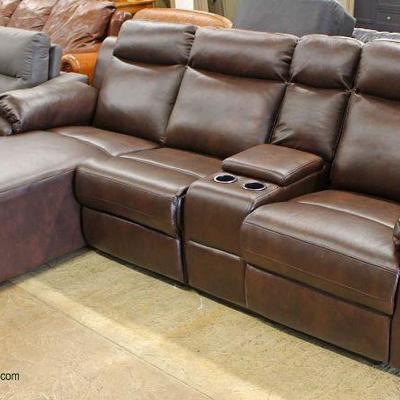  NEW Nice Size 2 Piece Leather Sectional with Recliner and Chaise and Cup Holdersâ€“ auction estimate $400-$800

 

  