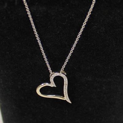14 Karat White Gold Â¼ CTW Diamond Heart Pendant and Necklace â€“ auction estimate $300-$600 
