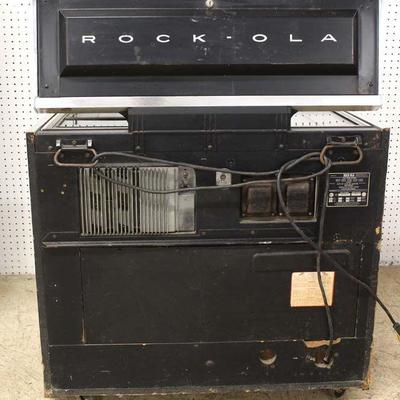  Mid Century VINTAGE â€œRock-Olaâ€ Juke Box, Lights Up in original found condition â€“ auction estimate $300-$600 