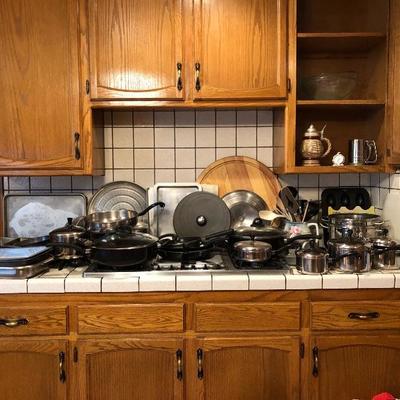 Kitchen packed with pots and pans and cooking items