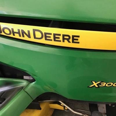 John Deere 300 lawn mower $2,300 firm