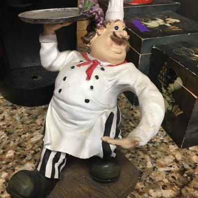 chefs statue carrying a serving tray
