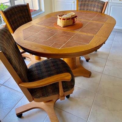 Oval Wood Pedestal Tile Top Dinette Set with One Leaf and Four Upholstered Chairs on Wheels  (Table 42