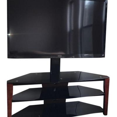 Sony television and 3 shelf glass display.