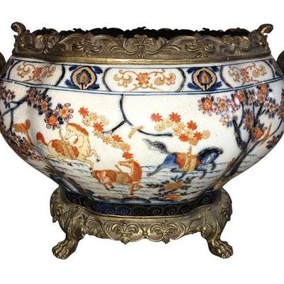 Decorative porcelain footed urn. The crackled navy, burnt orange and gold accent design brings elegance and texture to the Bombay shape. 

