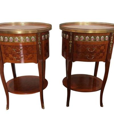 Lovely pair of Italian oval side tables, with two drawers and shelves, with brass accent surround. The old world parquetry and hand cut...
