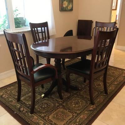 Kitchen Table 60 l x 40 w x 29.5 t with 8 chairs has 1- 18 leaf includes table pad 