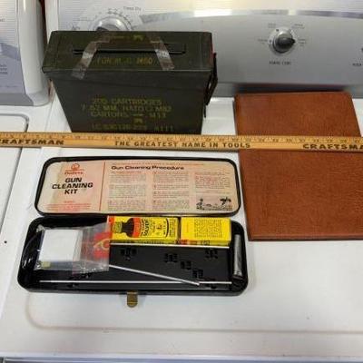#123: Ammo can, gun cleaning kit, leather rifle holster and a yard stick
Ammo can, gun cleaning kit and a yard stick
