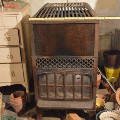 Gas heating stove (in basement)