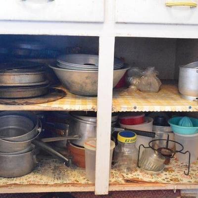 All kitchenware & dishes in lower cabinets & two d ...
