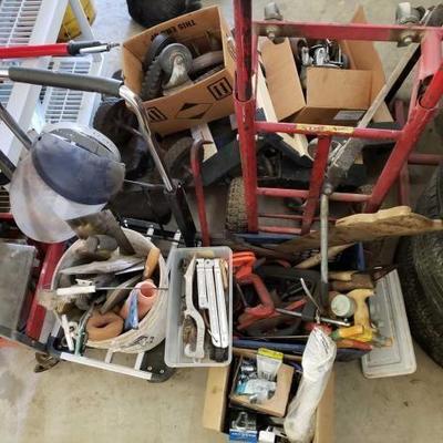 #867: 2 Dolly's, C Clamps, Hand Saws, Trowels and More...
2 Dolly's, C Clamps, Hand Saws, Trowels and More...Clear bin with misc tools in...