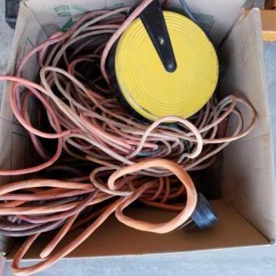 #836: Box of Various Extension Cords, 1 Extension Cord Reel
Box of Various Extension Cords, 1 Extension Cord