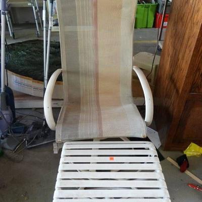 Patio chair with foot rest.
