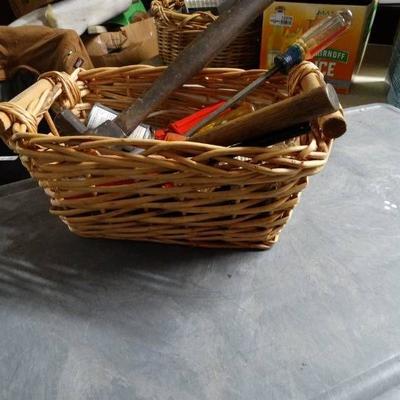 Small basket with hammers, string, tools.