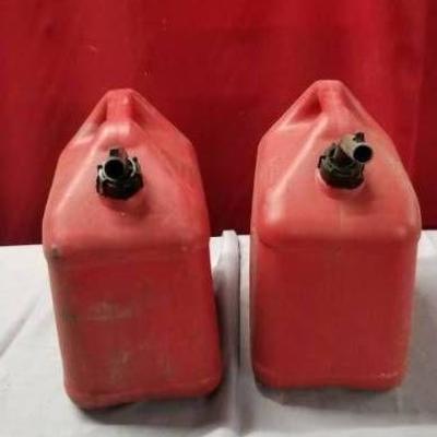 Two Red Plastic Gas Cans