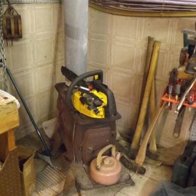 McCullogh chain saw and antique stove