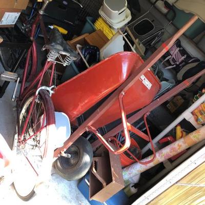 Shed full of tools, wheelbarrow, pet related items