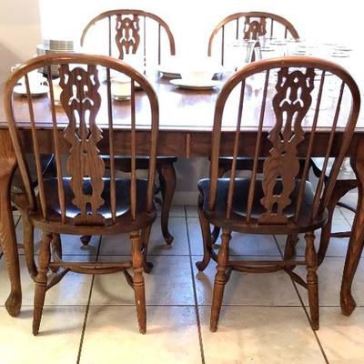 Solid wood dining room table and wooden chairs