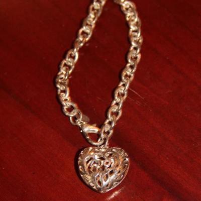 Sterling bracelet with hollow heart charm
Price: $20