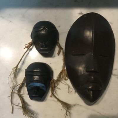 African Mask. The larger mask is ceramic.