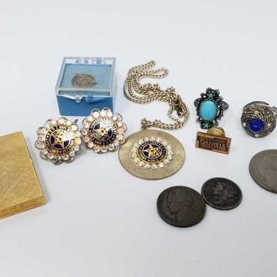 #585: Assorted Costume Jewelry and Coins
Pins, clip on earrings, lighter, coins and rings