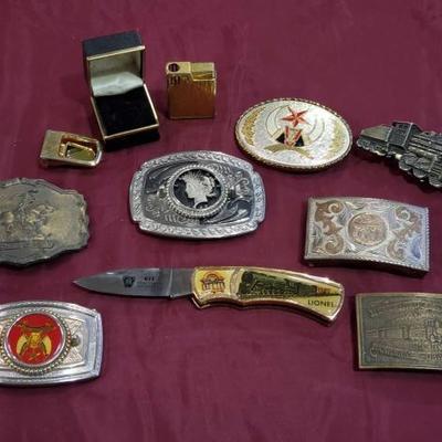 #771: Assorted Belt Buckles, Lionel Pocket Knife, and Lighter
Wells Fargo Buckle, Pony Express Buckle, Train Buckle, Peace Dollar Buckle...