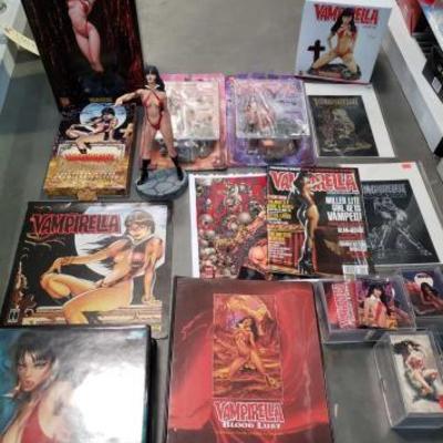 #1044: Vampirella Memorabilia, Statues, Trading Cards, Magazine, and Poster
Loose trading cards, binders of trading cards. One statue is...