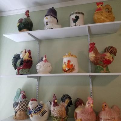 Three shelves of collection of cookie jars 