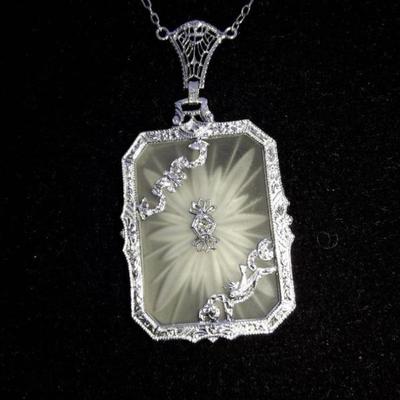 14K white gold diamond camphor glass lavalier  from the 1920's.