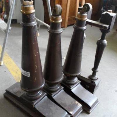 Lot of piano legs and piano pedals