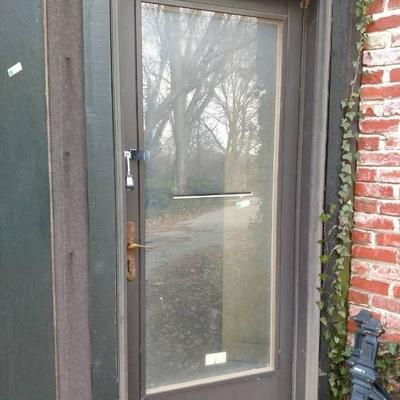 Glass Entry Door With Brass Handle