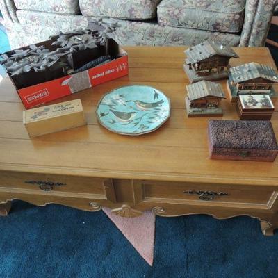 vintage music box collection and cuckoo clocks, Ethan Allen coffee table
