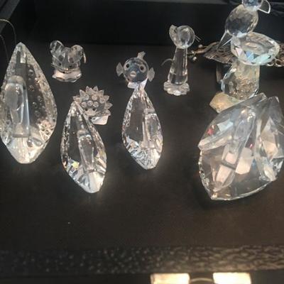 A collection of Swarovski crystal figurines, swans, mouse, bird in bird bath, hedgehog and more!