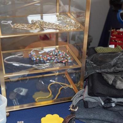Gold Shelving Unit, Costume Jewelry, Gloves, & Blankets