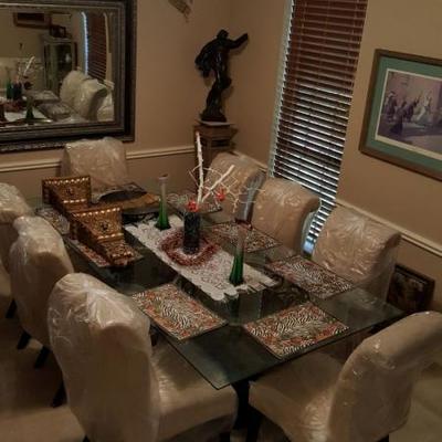 . Solid beveled glass large dining table with eight chairs