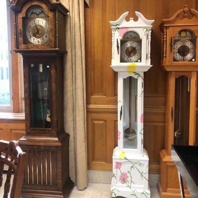 Grandfather clocks including one Howard Miller