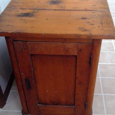 bedside or end table with large storage compartment