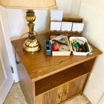 Multi-Use Table with Brass Lamp and Office Items