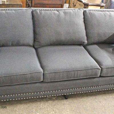  NEW Contemporary Grey Upholstered Sofa with Throw Pillows

Located Inside â€“ Auction Estimate $300-$600

  