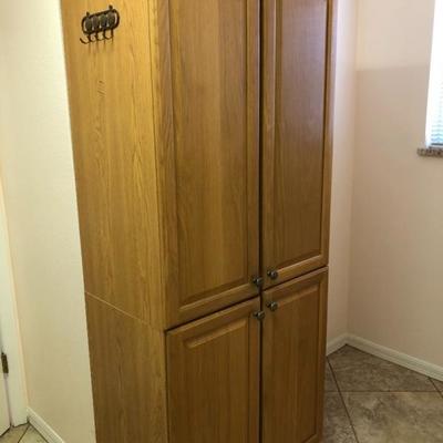 Two Storage cupboard/pantry in oak finish, each w/2 doors, shelving - $80 Each